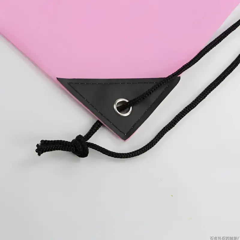 Pink drawstring bag corner.
