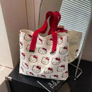 Hello Kitty patterned tote bag with red straps.
