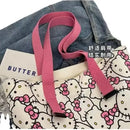 Hello Kitty patterned tote bag with pink straps.