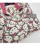 Hello Kitty patterned tote bag with pink straps.