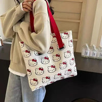 Hello Kitty patterned tote bag with red straps.