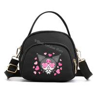 Black crossbody bag with cartoon character.