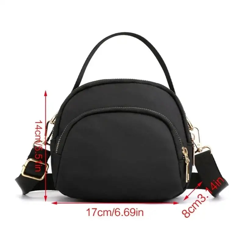Black nylon crossbody bag with dimensions.