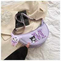Lavender purse with cartoon character and initial.