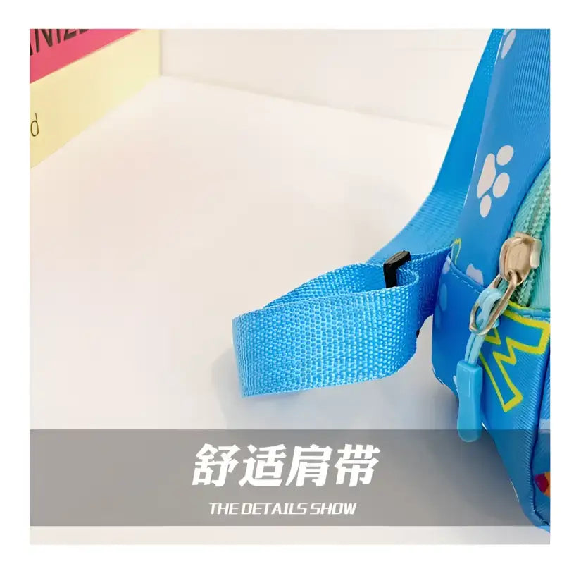 Blue cartoon shoulder bag.