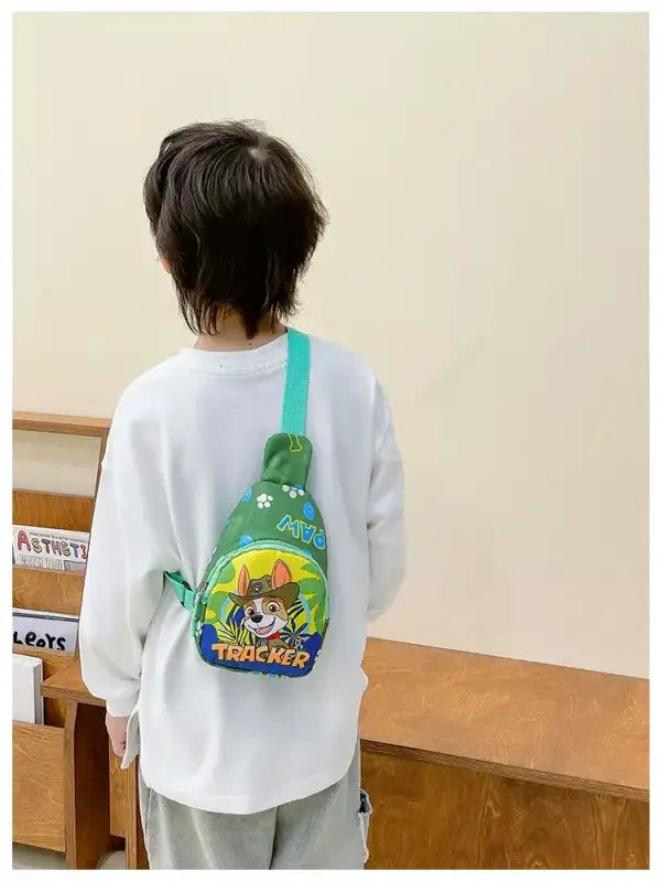 Child’s green Paw Patrol Tracker sling bag.