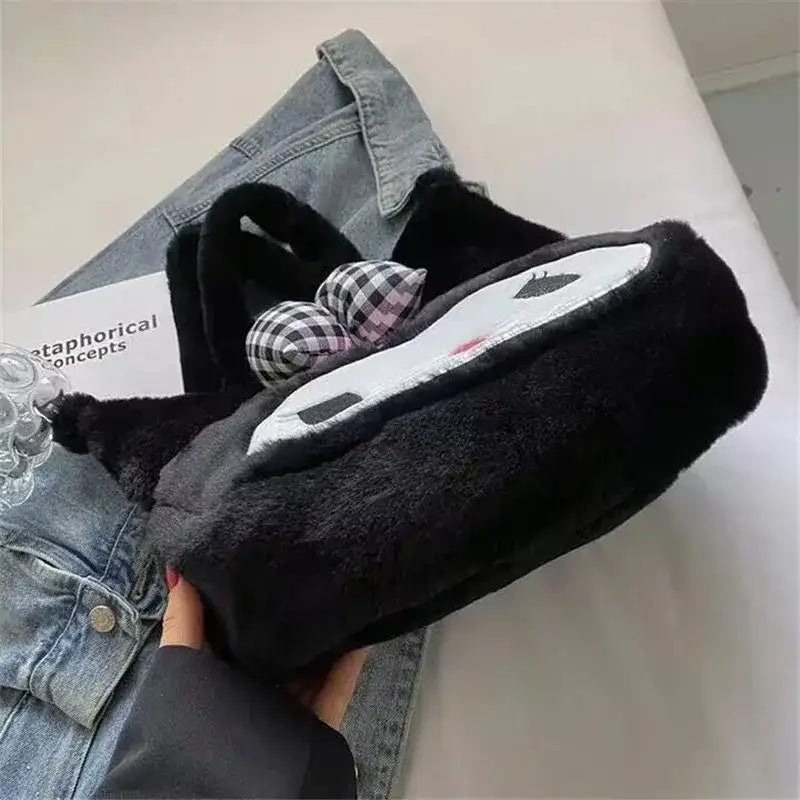 Black plush handbag with a white face and checkered bows.