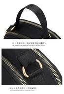 Black handbag with gold hardware.