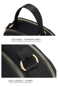 Black handbag with gold hardware.