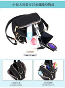 Black crossbody bag with multiple compartments.