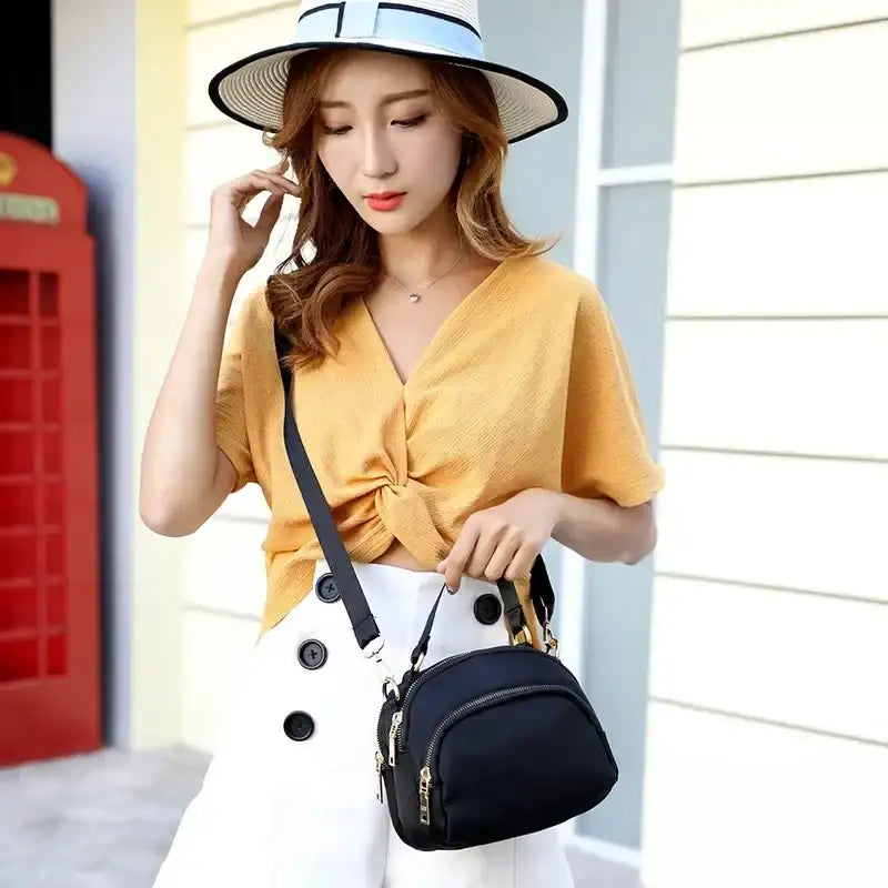 Black nylon crossbody bag.