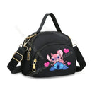 Black handbag with cartoon characters.