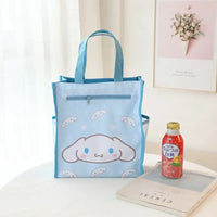 Light blue tote bag with cartoon character.
