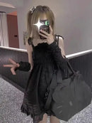 Black dress with Hello Kitty bag.