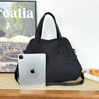 Black Hello Kitty handbag.