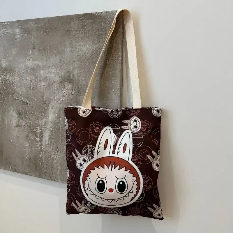 Brown tote bag with rabbit design.