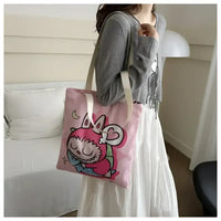 Pink tote bag with cartoon character.