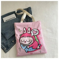 Pink tote bag with cartoon rabbit design.