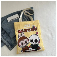 Yellow tote bag with cartoon characters.