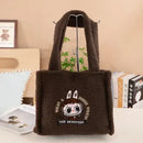 Brown fuzzy tote bag with cartoon character.