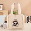 Fuzzy white cartoon-embroidered tote bag.