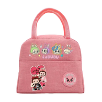 Pink cartoon-themed lunch bag.