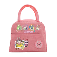 Pink cartoon-themed lunch bag.