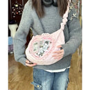 Pink heart-shaped ita bag.