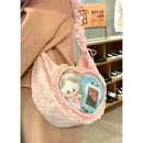 Pink heart-shaped ita bag with plush toys.
