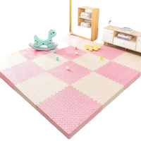Pink and beige foam play mat.