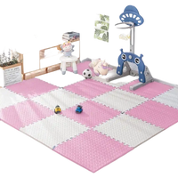 Pink and white foam play mat.