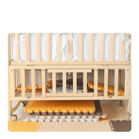 Wooden baby crib with storage.