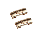 Two gold-colored magnetic press locks.