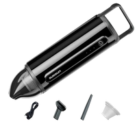 Black handheld vacuum cleaner with accessories.