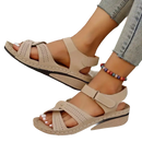 Beige women’s wedge sandals.
