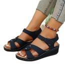 Navy blue wedge sandals.