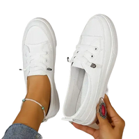 White canvas slip-on sneakers.