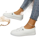 White slip-on sneakers.