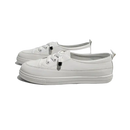 Pair of white lace-up sneakers.