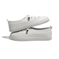 Stacked white sneakers.