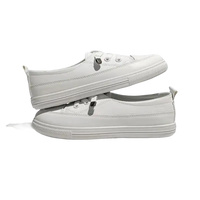 Stacked pair of white leather sneakers.