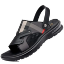 Black leather sandal with plaid accent.
