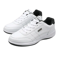 Pair of white leather sneakers.