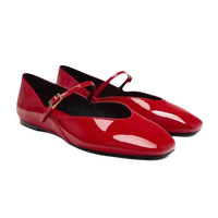 Pair of red patent leather Mary Jane flats.