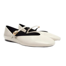 Pair of white patent leather Mary Jane flats.