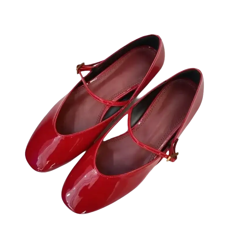 Pair of red patent leather Mary Jane shoes.