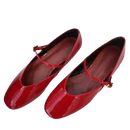 Pair of shiny red Mary Jane shoes.