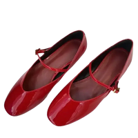 Red patent leather Mary Jane flats.