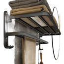Black metal towel rack with folded towels.