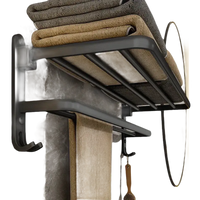 Black metal towel rack with folded towels.